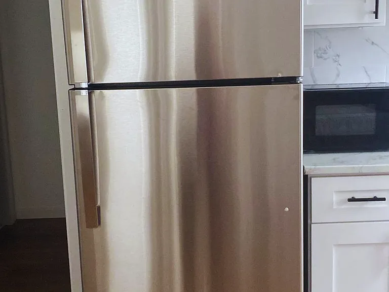 Kitchen with a spacious fridge to store all your favorite foods.