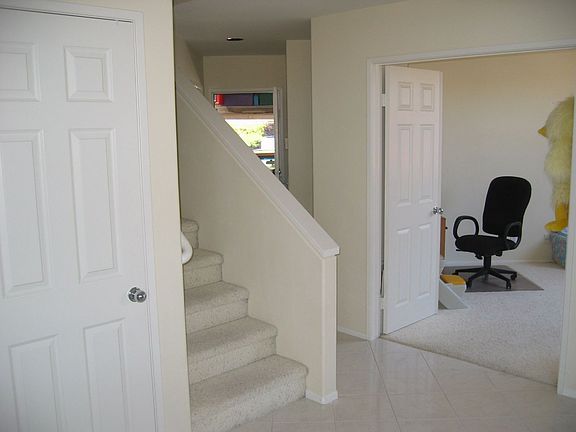 3rd bedroom downstairs/stairway/entry area