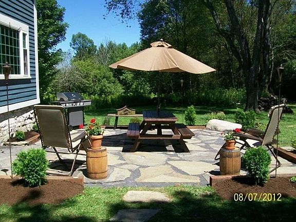 Patio : Lovely stone patio with scrubs and perennial flower garden