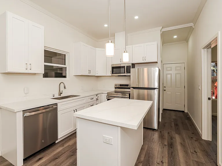 Modern kitchen with quartz-style counters and updated cabinetry