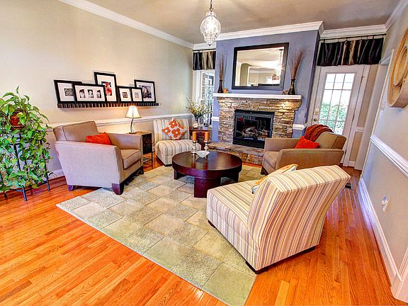 Gas Logs with Custom Stacked Stone Raised Hearth in the Family Room 
