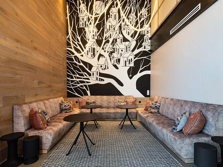Lounge space with mural art by Drew Button