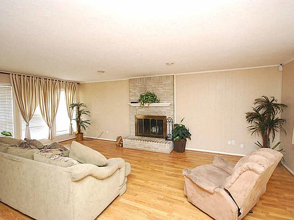 Large den with fireplace.