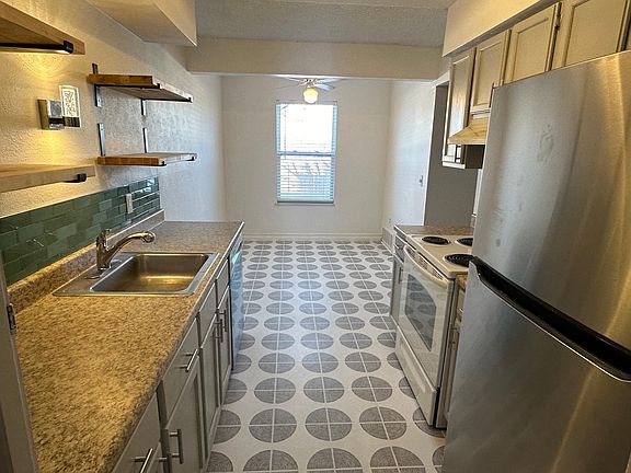 Brand new, stainless steel fridge and dishwasher.