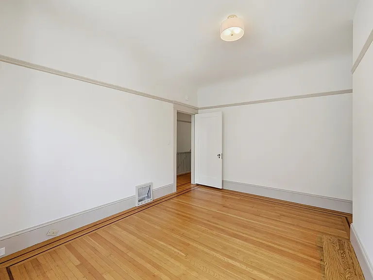Alternate view of 1st bedroom looking from window to the hall