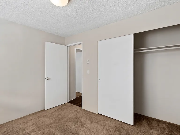 Enjoy tranquility in this serene bedroom with ample closet space. Enjoy tranquility in this serene bedroom with ample closet space.