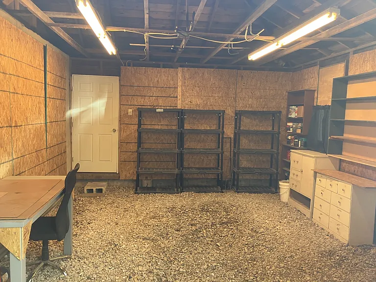 Detached Garage, inside view. Furniture may be removed to allow car storage.