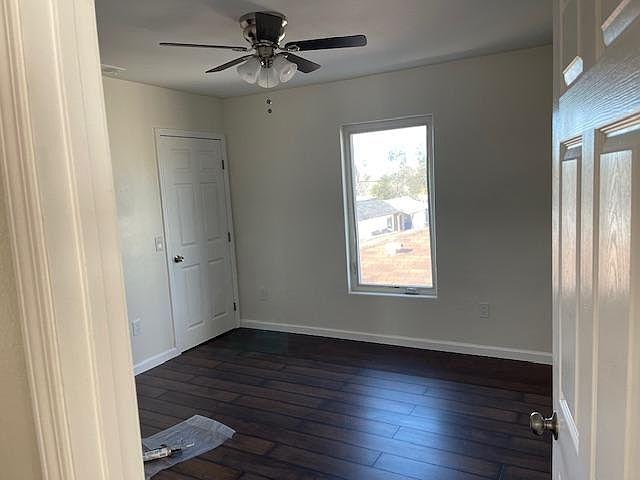 Bedroom #1 with fan and walk in closet