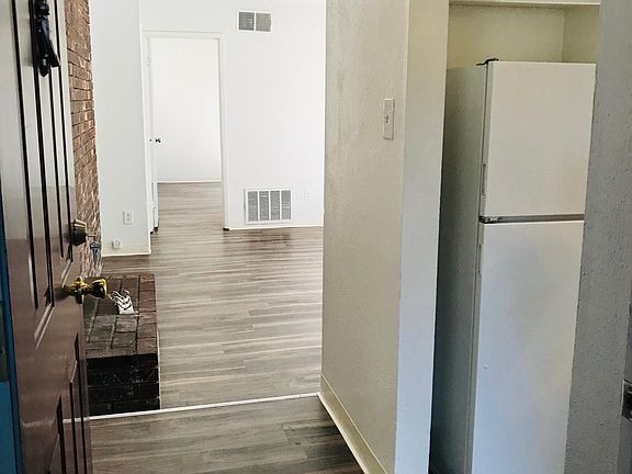 Remodeled unit with new wood like flooring.