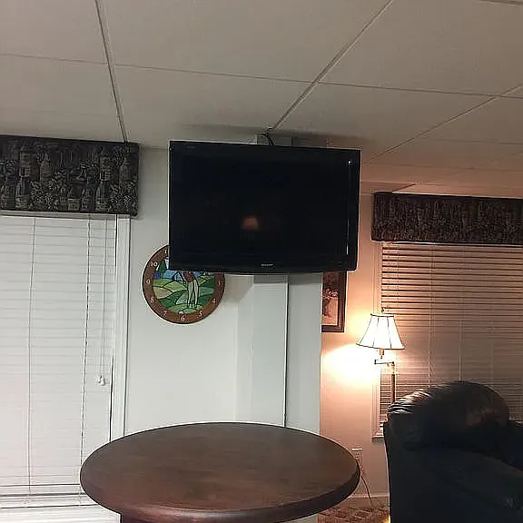 High Top Table and TV that swivels approx. 270 degrees for viewing from Lounge, bar, or pool table areas.
lower entertainment level.