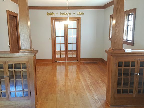 Dining room with study beyond french doors (study often used as 4th bedroom, has closet)