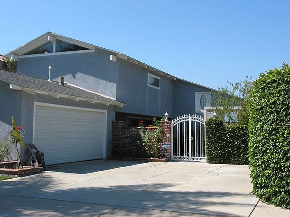 Enter through tropical gardens w/koi pond