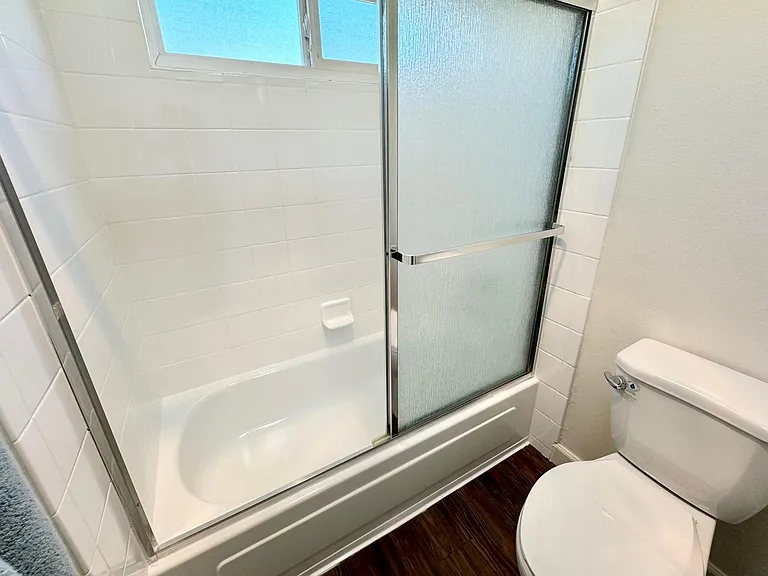 Shower tub combo, newly reglazed and new toilet