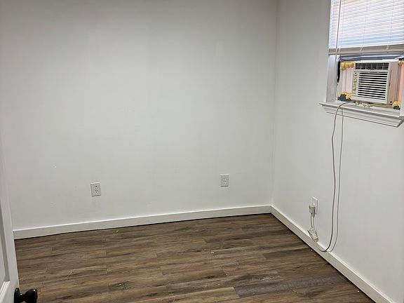 Bedroom 1 has walk in closed, window ac for additional personal cold air if desired.