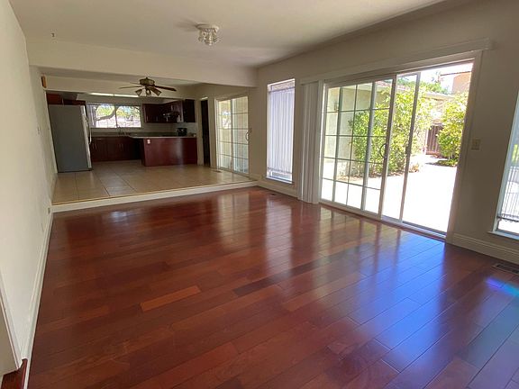 Family room and kitchen, also open layout. Sliding door leads to the backyard!