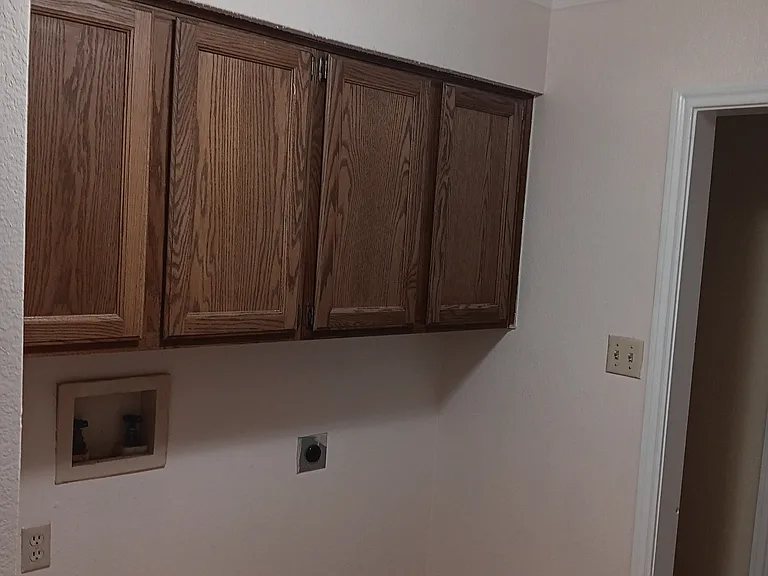 Do laundry when you prefer! Laundry room with full size washer & dryer connections. Wood cabinets w/shelving for storage.