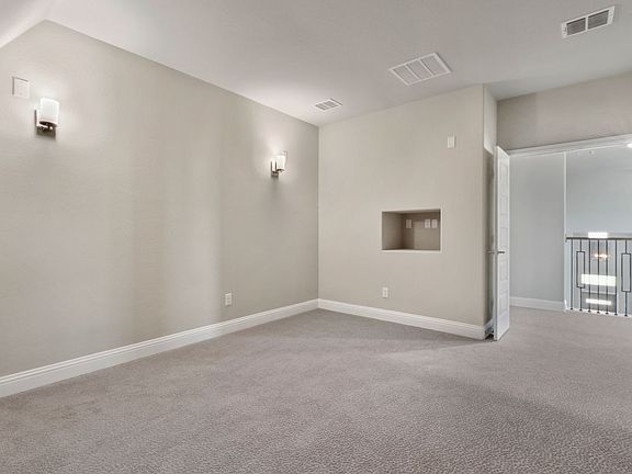 Media room in the Olympic home plan by Trophy Signature Homes - REPRESENTATIVE PHOTO