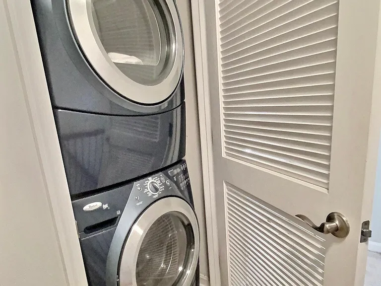 Laundry located between the two upstairs bedrooms.