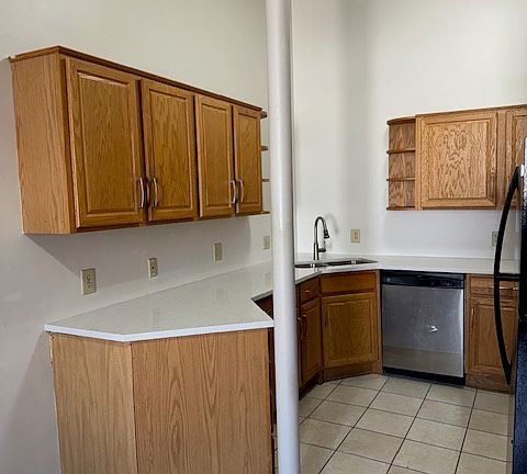 Full Kitchen, new hard surface counter top sink and faucet and stove.
