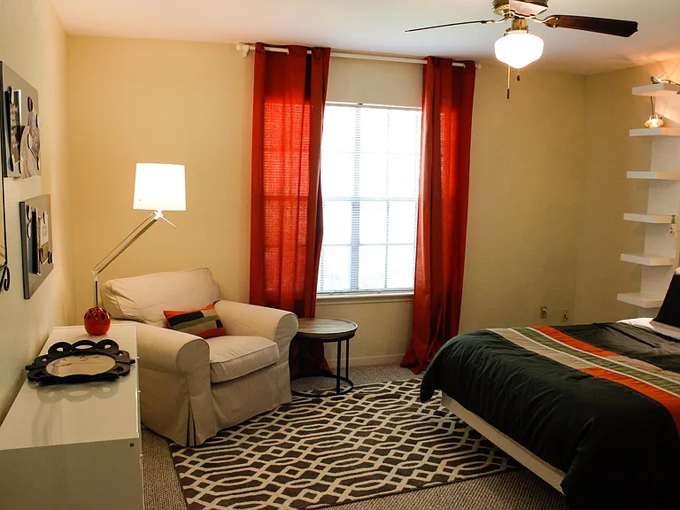 ... and in your sitting area, a comfy chair with a reading light and side table.
