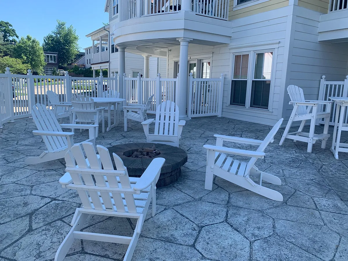 Common Patio Area outside of condo with fire pit and pool - 333 Cottage Ln #A
