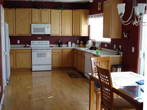 Hardwood floors and huge kitchen with walk out from diningroom