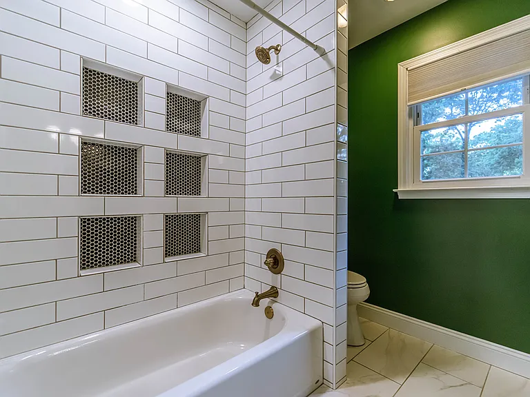 Built-in nooks in the shower.