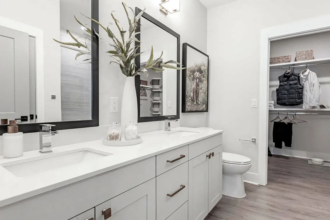 Luxurious bathroom with double vanity and spacious walk-in closet