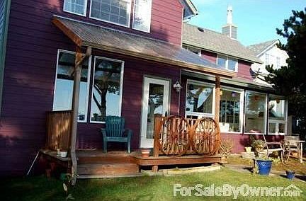 Deck, yard and windows facing the bay