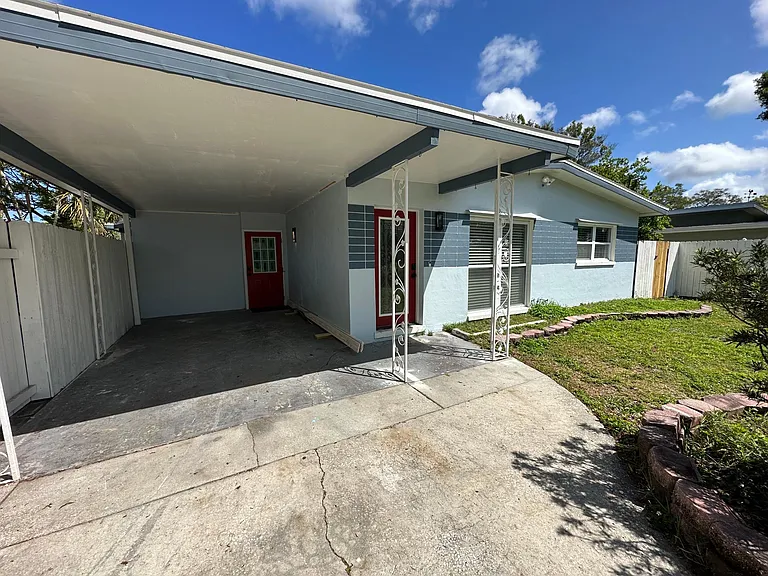Front of House with Carport