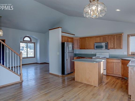 Kitchen with island and plenty of storage space.
