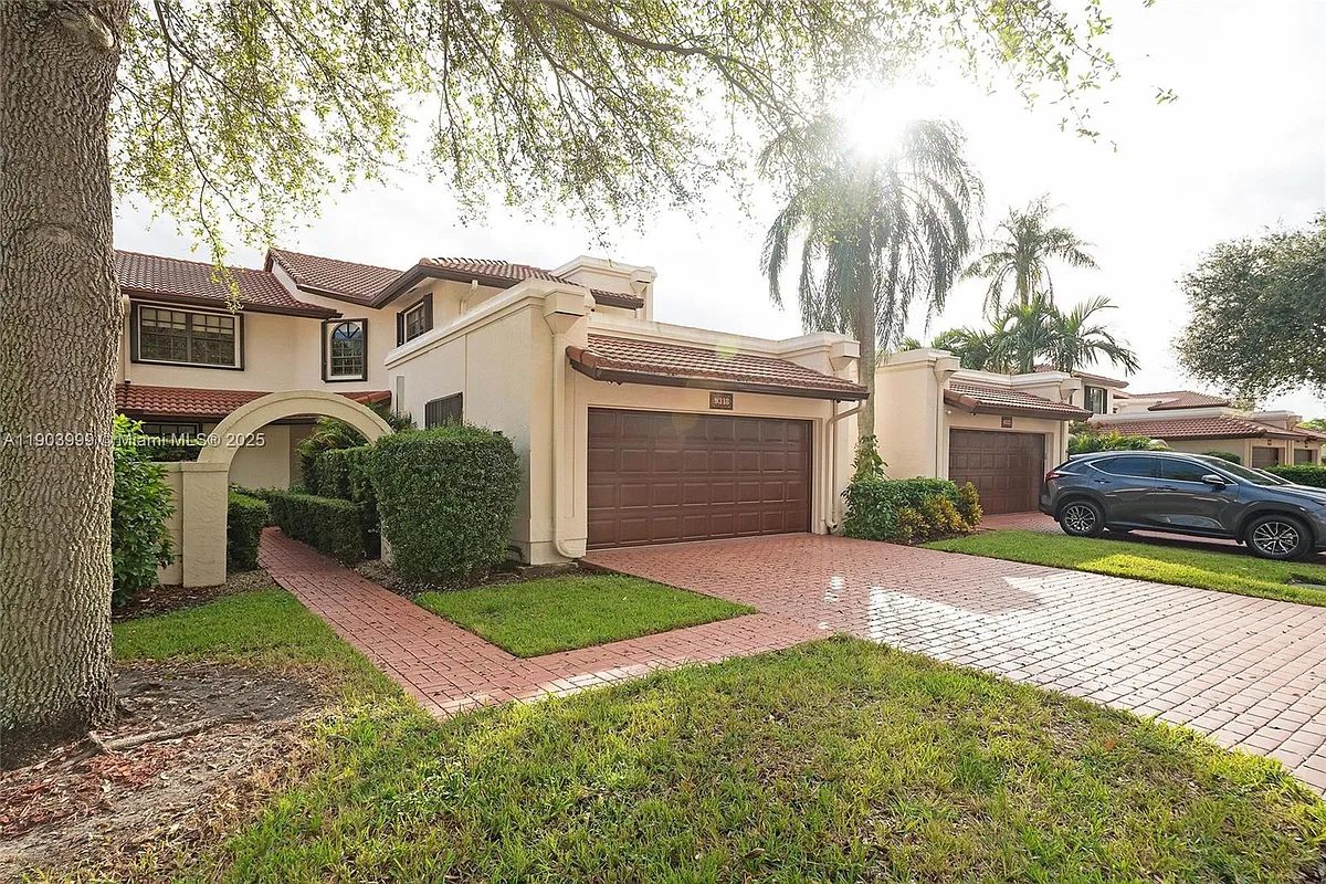 Photo 2 of 56 - 9318 NW 50th Doral Cir S - Doral, FL Building Photo - 9318 NW 50th Doral Cir S