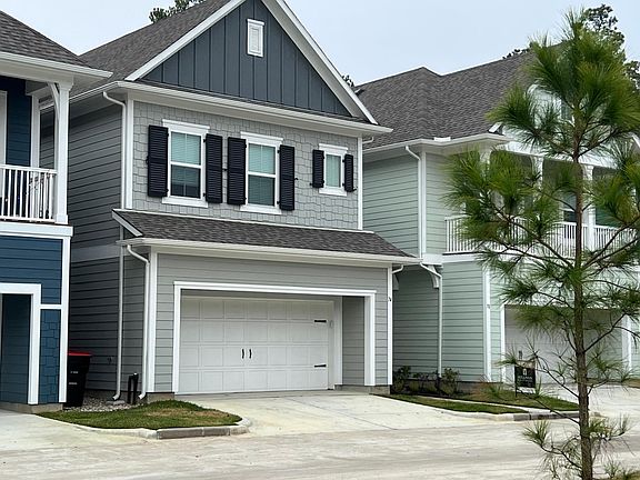 Front of home with two car garage, plenty of storage and additional parking.