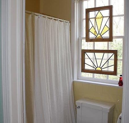 Beautiful stained glass windows in the bathroom.