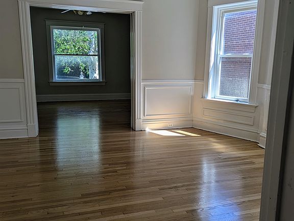 In hallway in front of master bedroom door, looking to living rooms. (not pictured is hallway closet to right)