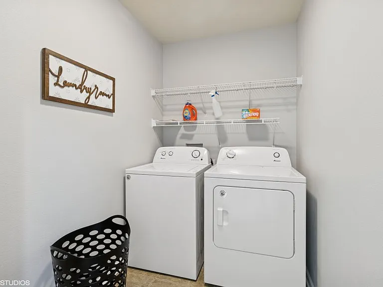 in unit washer & dryer, full size ironing board & iron.