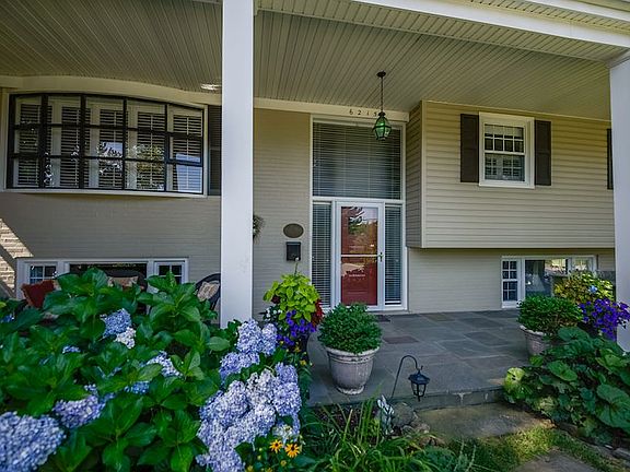 Great 1/4-acre + lot w/Lush landscaping in front/rear yards
