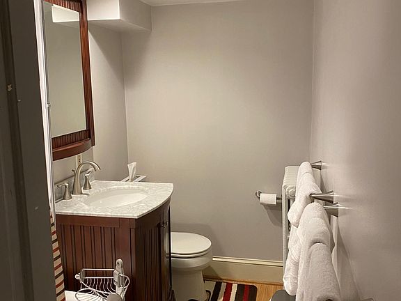 Newly remodeled bathroom with clawfoot tub and shower combo, vanity and matching mirror, toilet, recessed lighting, fan combo with heat fan/regular fan/light/nightlight. All towels included!