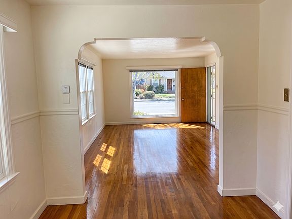 Dining and living room. Note the arched entry.