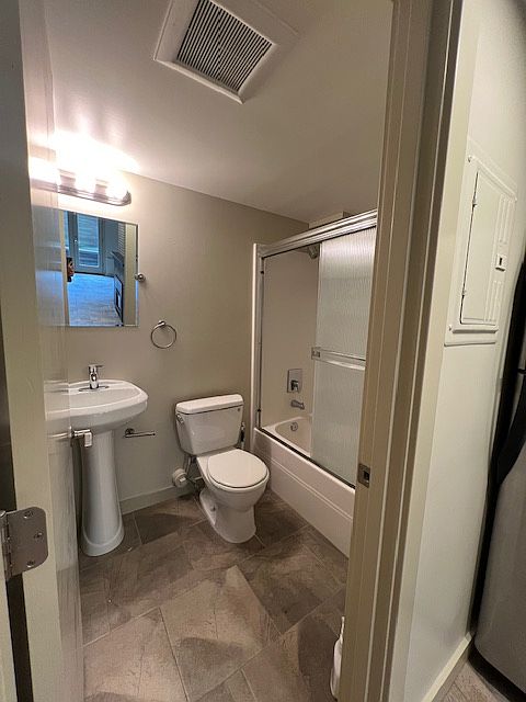Bathroom with shower/tub combination.