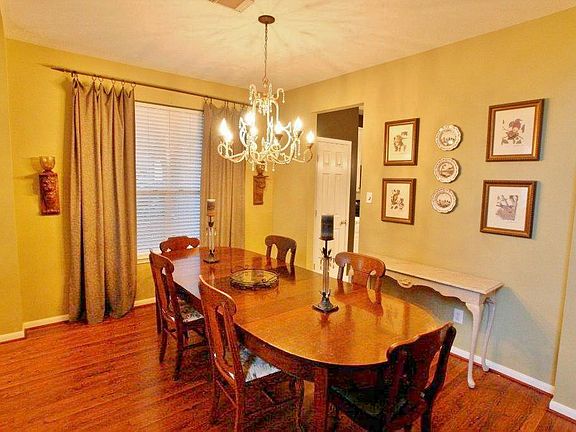 Dining Room features warm wood floors