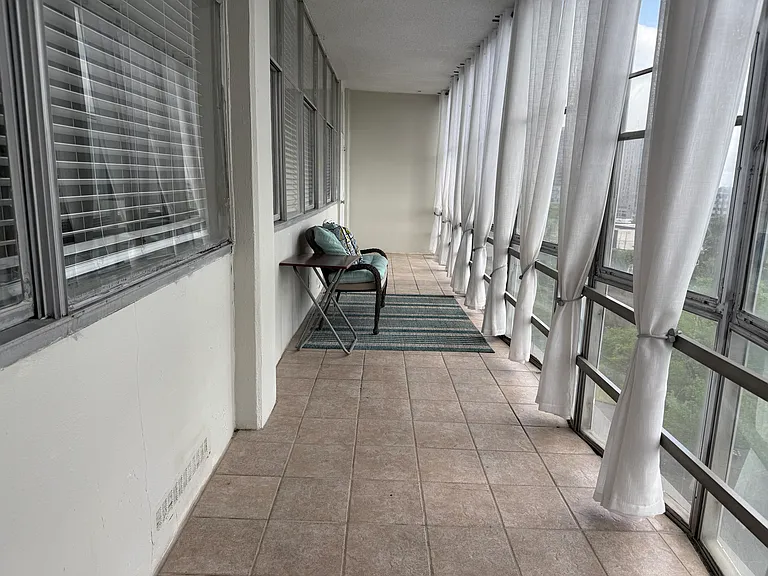 Enjoy a bright and spacious floor-to-ceiling enclosed porch with expansive windows that bring in plenty of natural light. This versatile space offers a relaxing extension of the condo and is perfect for enjoying your morning coffee.