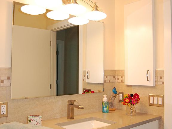 Bathroom with walk-in shower.