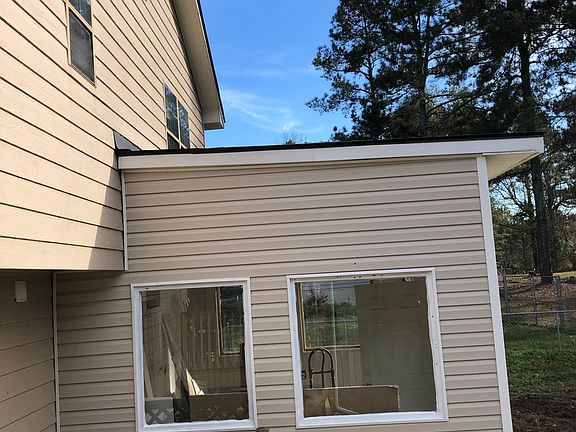 View from backside. Sunroom is visible.