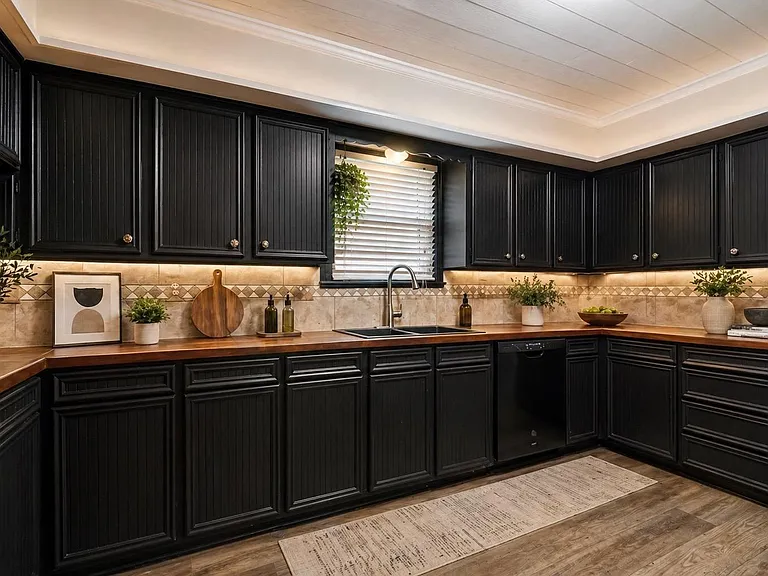Spacious kitchen with extensive cabinet storage, wide countertops, and a double-basin sink with dishwasher for easy cleanup.
