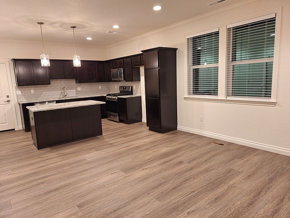 The versatile island keeps the space open but allows for more counter space.