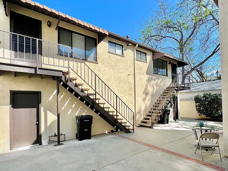 Triplex boasts 2 rental units, plus landlord owner in front residence