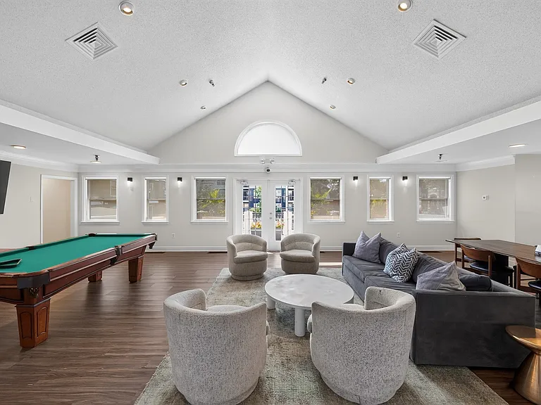 Elevate your lifestyle at Eagle Rock Apartments at Columbia Pike. This thoughtfully designed lounge area offers a perfect blend of comfort and style, featuring cozy seating and a vibrant atmosphere. Explore your new community today!