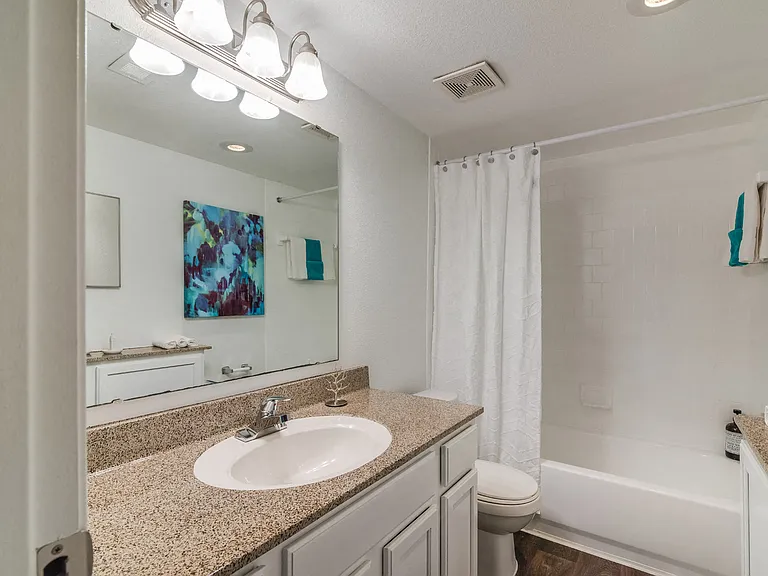 Bathrooms with modern fixtures and great lighting