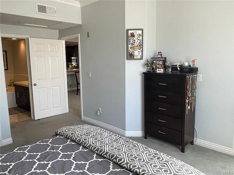 Main bedroom with carpet flooring